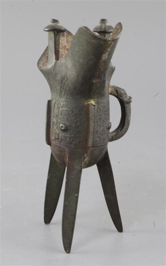 A Chinese archaic bronze wine vessel, Jue, Shang dynasty or later, 19cm high